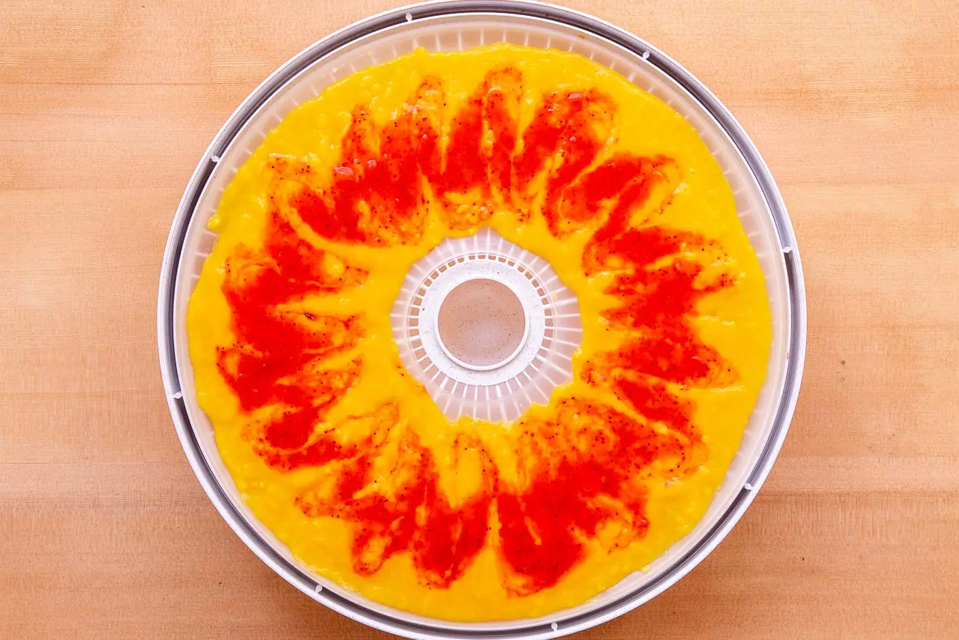 Dehydrator tray loaded with fruit puree
