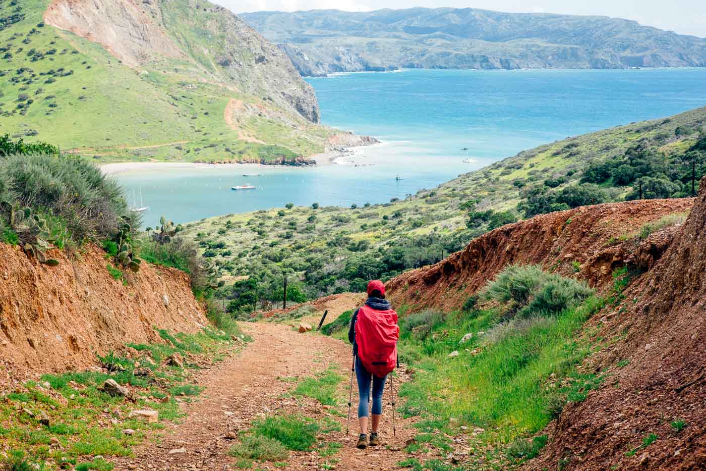 Woman hiking into Cat Harbor on the Trans Catalina Trail