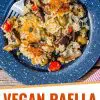 Pinterest graphic with text overlay reading "Vegan paella camping meal"