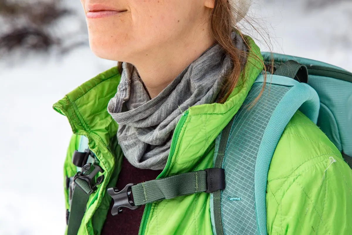 Tight in shot of a woman wearing a neck gaiter