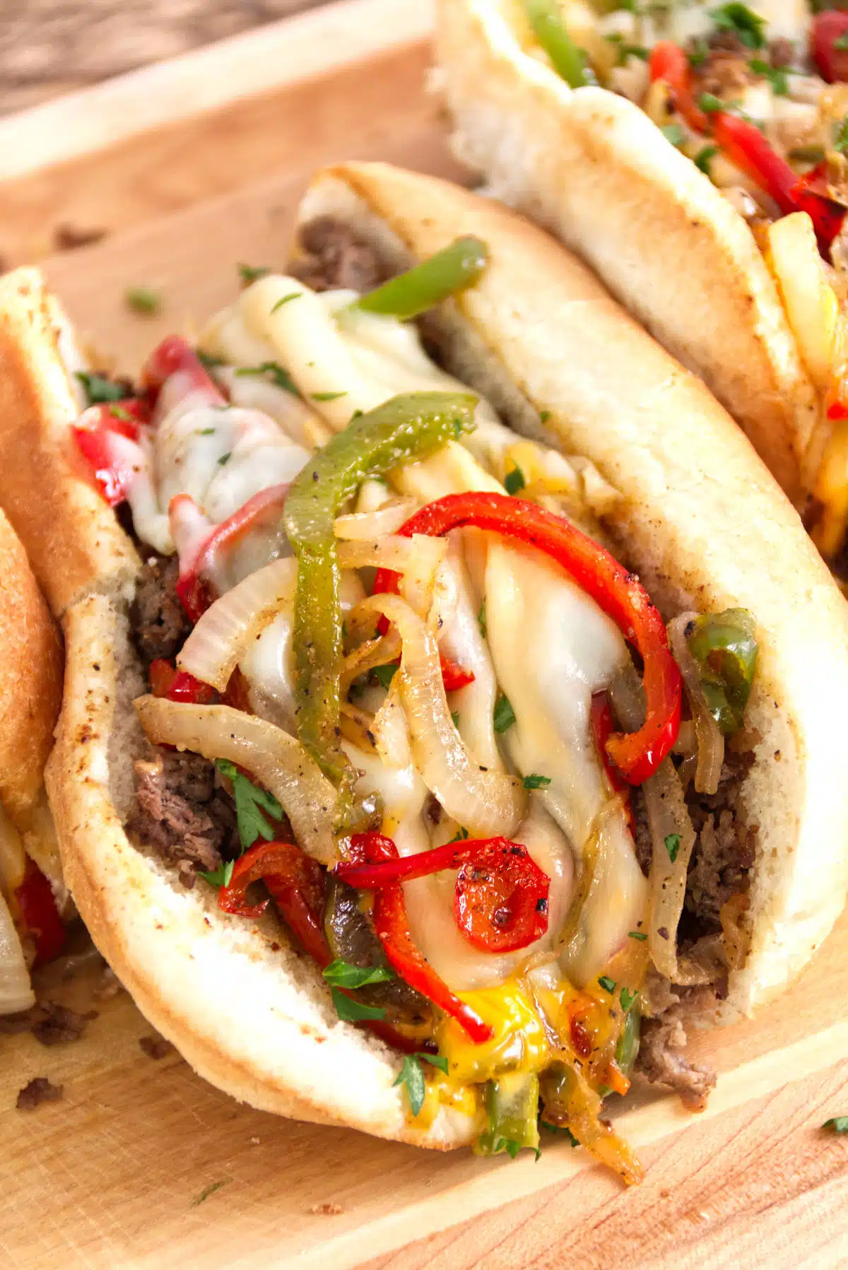 Meat, cheese, and bell peppers in a hoagie roll.