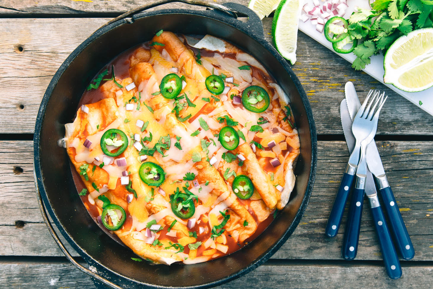 Enchiladas in a dutch oven on a table