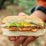 Holding a halloumi breakfast sandwich