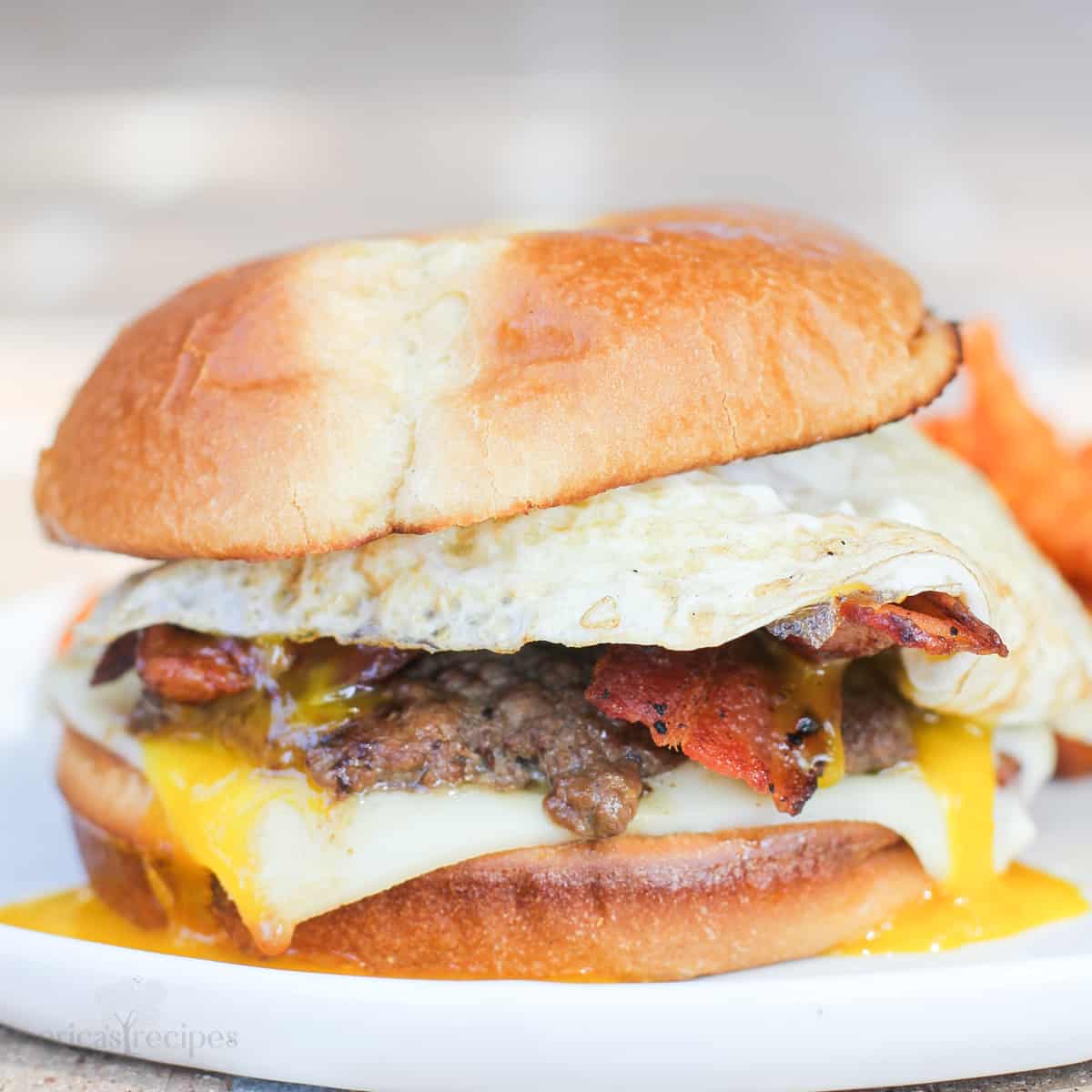 A burger topped with a fried egg.