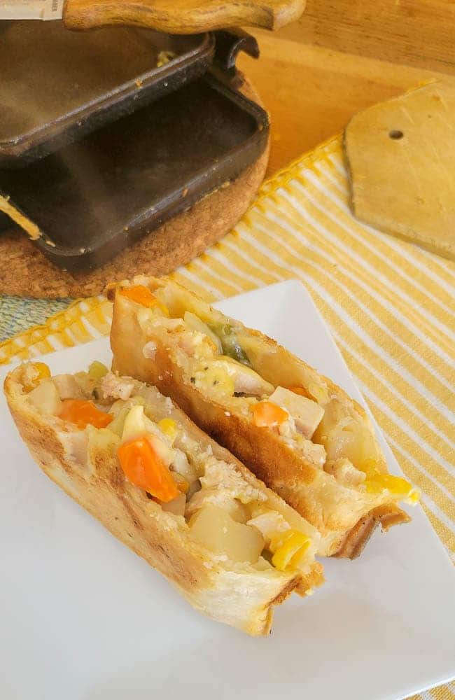 A camp cooker sandwich stuffed with pot pie filling.
