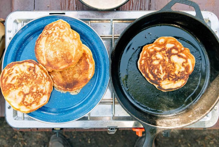 Pumpkin Spice Pancakes cooking on a camping stove