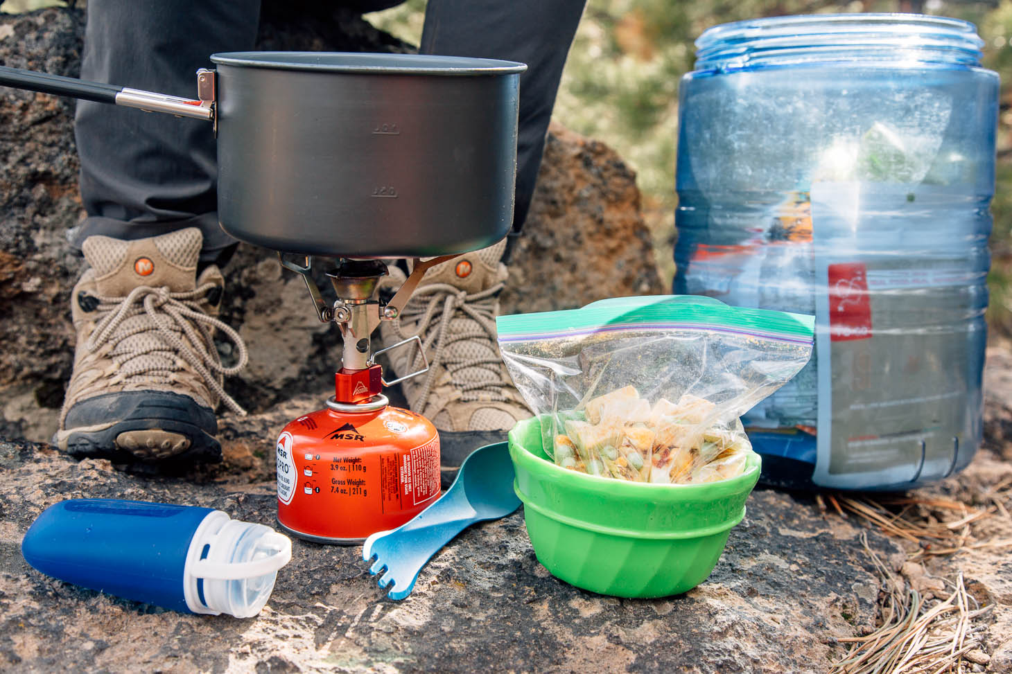 Ingredients and supplies to cook red curry rice while backpacking.