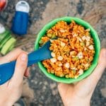Thai red curry rice in a green backpacking bowl