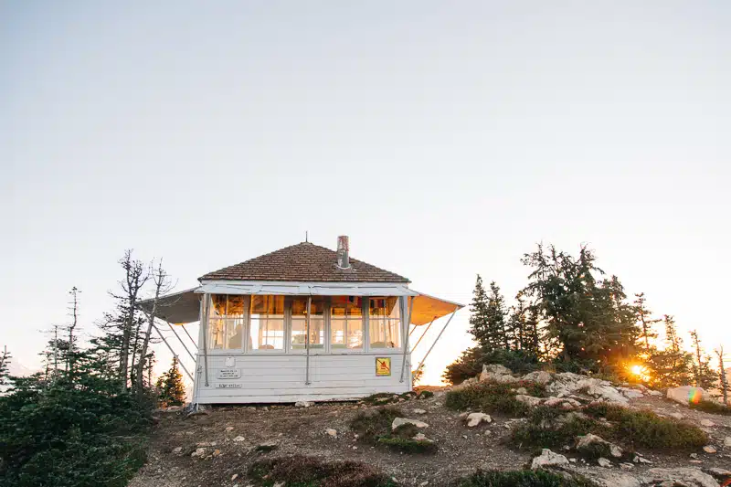 The Winchester Mountain fire lookout building perched on a rocky outcropping.